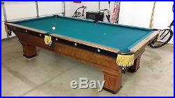 1920's Brunswick tournament 9' pool table with ball rack and neon signs