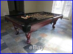 8 foot canon pool table with pool cues balls and triangles