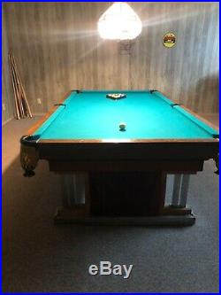 8ft brunswick pool table. Worth over $6000 comes with pool cues