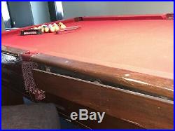 Antique 9-Foot Pool Table. Billiards pool table With Cues and Pool Ball