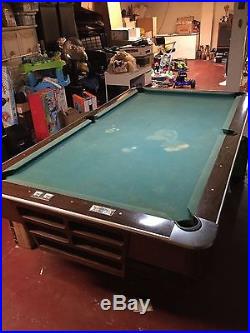 Antique Brunswick professional pool table with original balls and more