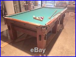 Antique Mission Style Brunswick billiard pool table with accessories