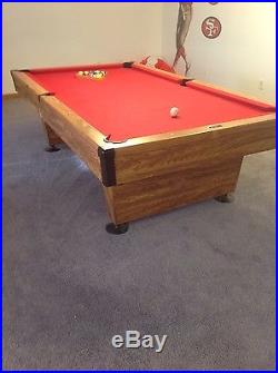 Brunswick Billiards 8ft Pool Table with red felt and pockets