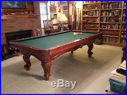 Brunswick pool table with extras (chair, rack & cues)