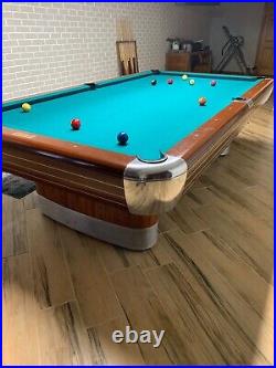 Brunswick vintage 9ft. Tournament size pool table with cue holder