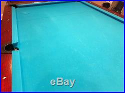 Diamond Pro Am 9ft pool table in cherry finish with matching light