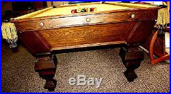 Late 1800's Antique Brunswick Pool Table cue stand and cue sticks