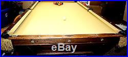 Late 1800's Antique Brunswick Pool Table cue stand and cue sticks