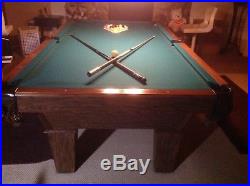 Olhausen 8ft Pool Table Walnut frame with green felt. Includes balls and cues