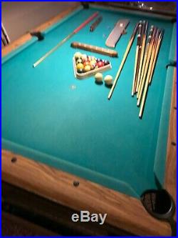 Pool table & pool balls, 9 cue sticks, stick rack, custom 2 piece plywood cover