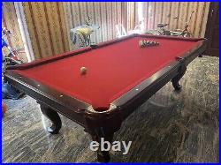 Pool table with cue rack