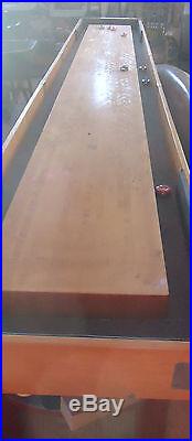 Vintage American shuffleboard table and accessories